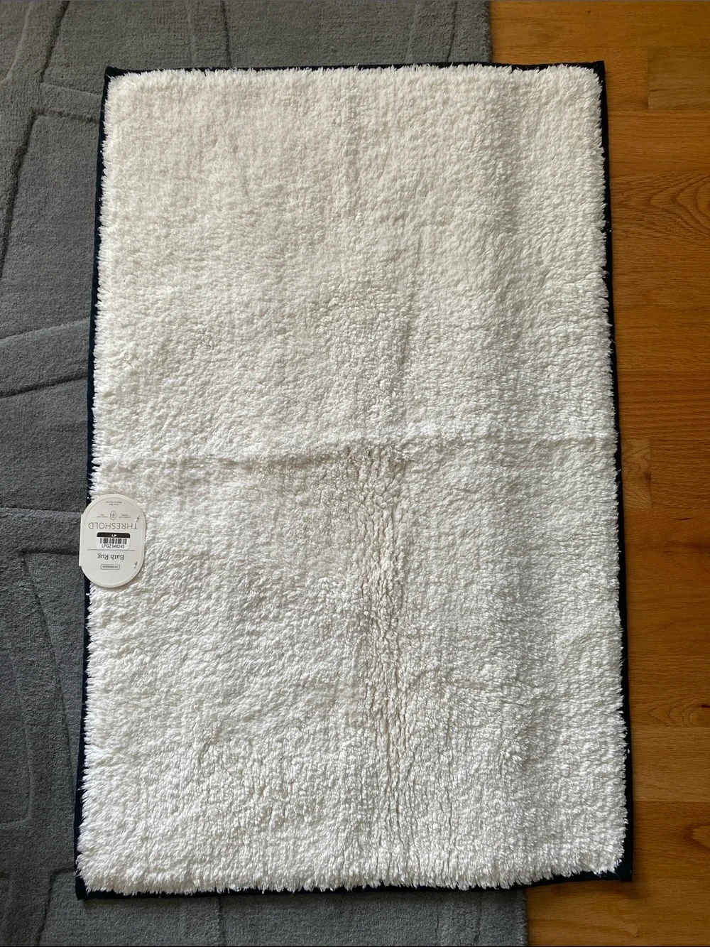 NWT Threshold Ivory and black border Bath Rug